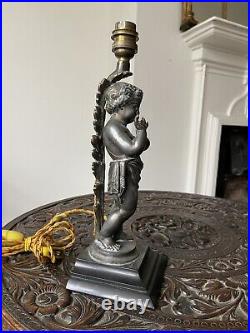 A French early 20th century, silver bronze putti lamp, marble base, 30cm