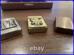 Not for sale Set of three Marlboro Zippo lighters gold, silver, and bronze